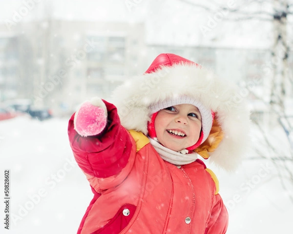 Obraz The kid in red jacket winter.