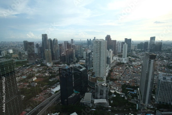 Fototapeta Jakarta city viewed from the top and at sunset