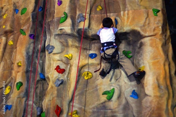 Obraz Little boy Climbing A Wall