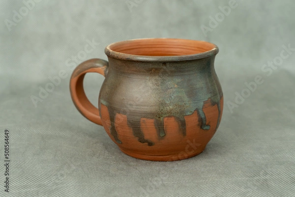 Obraz Ceramics, a ceramic product made with hands, made on a potter's wheel, a jug, a mug, clay.