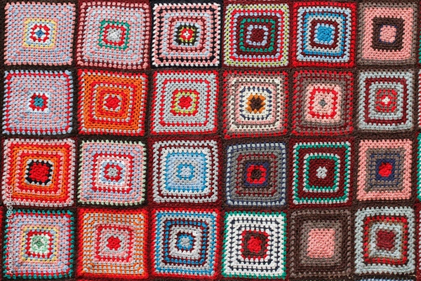 Obraz Detail of a crocheted patchwork multicolor wool blanket.