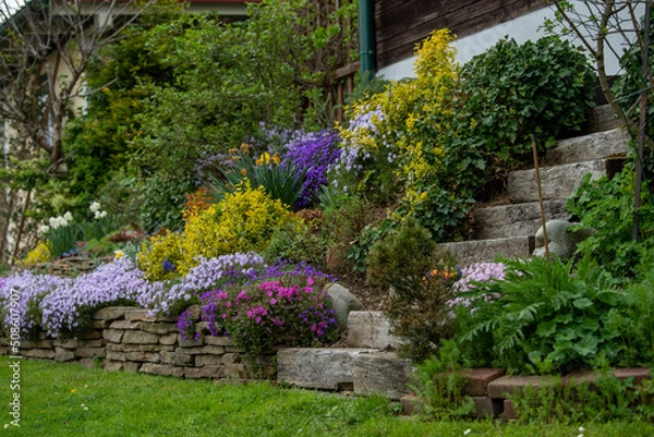 Obraz Planters slope with stone steps in a garden