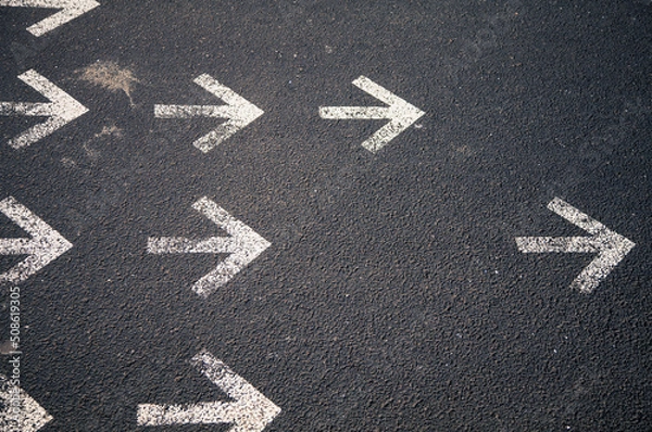 Fototapeta group of arrows marked on a street