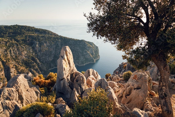 Obraz Beautiful evening seascape of sea. Sandy beach of the blue lagoon landscape. Panoramic view. Butterfly Valley is a valley in Fethiye district, Oludeniz, Turkey. View from the top of the cliff
