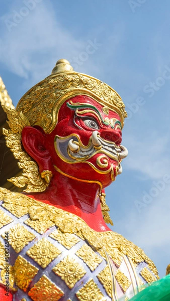 Obraz A giant red-colored statue guarding the temple.
