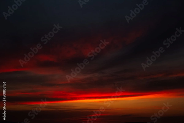 Fototapeta Beautiful landscape of sunset with dark colourful clouds. Natural background.