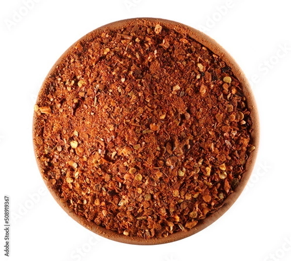 Fototapeta Spicy chili pepper flakes, crushed, milled dry paprika pile in clay pot isolated on white, top view