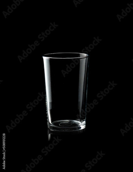 Obraz Empty glass of water isolated on black background