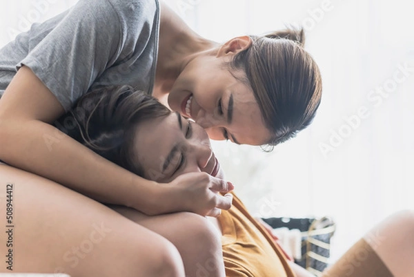 Fototapeta LGBT Asian lesbian couples hugging each other
