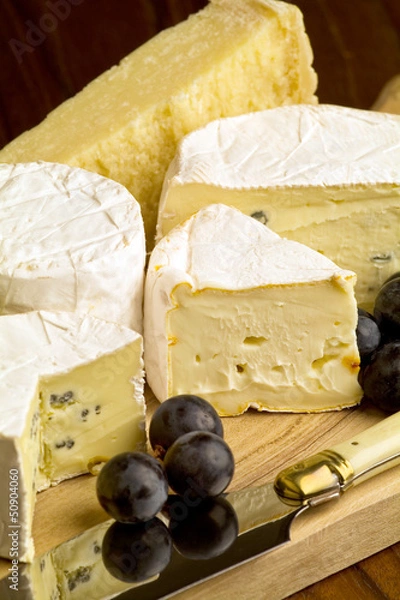 Fototapeta Different sorts of cheese with grapes