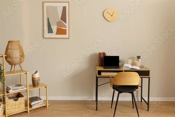 Obraz Modern light home office interior with desk and laptop, mockup on pc screen
