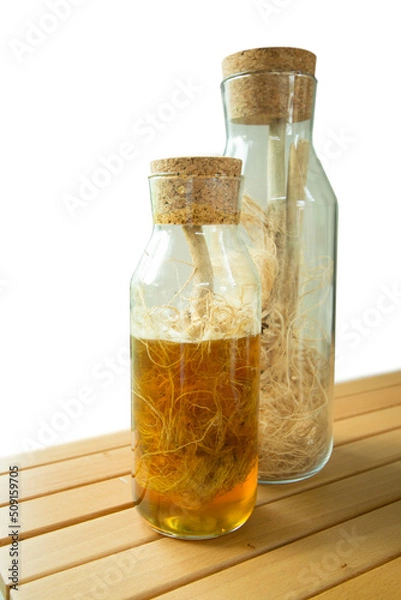 Obraz Honey-picked dried hemp root in a glass jar.