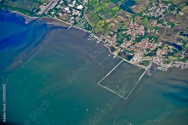 Fototapeta Jakarta Bay view from the airplane window that looks crowded and busy