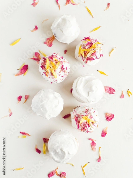 Obraz Cake with edible flowers and whipped cream. Shallow dof .