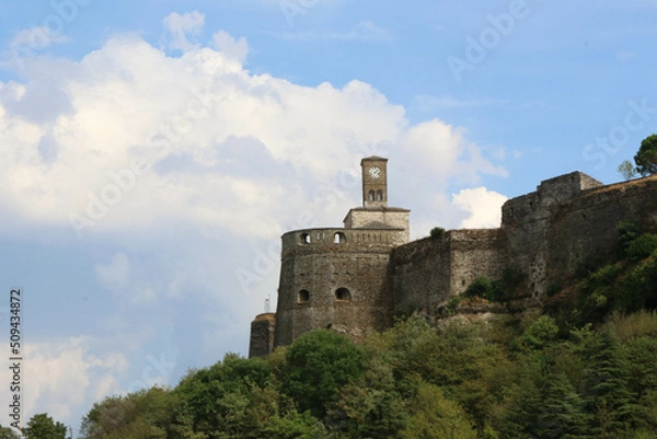 Fototapeta Beautiful view of the Gjirokaster castle clock with a blue sky and white clouds, Albania.