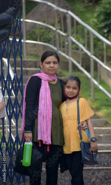 Fototapeta AN INDIAN MOTHER AND HER DAUGHTER IS ENJOYING IN ZOO HYDERABAD ELANGANA INDIA