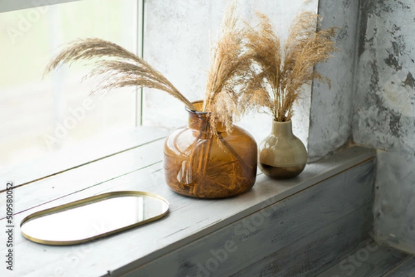 Fototapeta two glass vases are on the windowsill