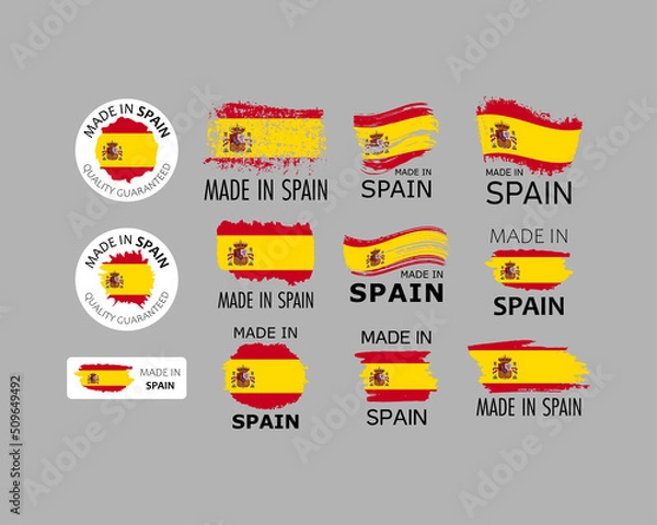 Fototapeta Set of stickers. Made in Spain. Brush strokes shaped with Spanish flag. Factory, manufacturing and production country concept. Design element for label and packaging. Vector colorful illustration.