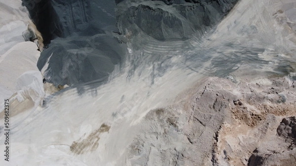 Fototapeta An aerial view of the piles of fine stone in the quarry. Fine stone is used in the production of quality asphalt for roads and for the preparation of concrete used in construction