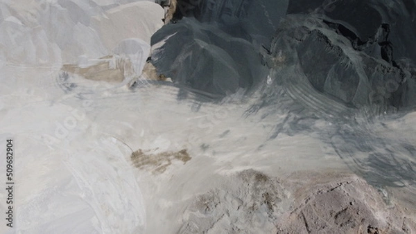 Fototapeta An aerial view of the piles of fine stone in the quarry. Fine stone is used in the production of quality asphalt for roads and for the preparation of concrete used in construction