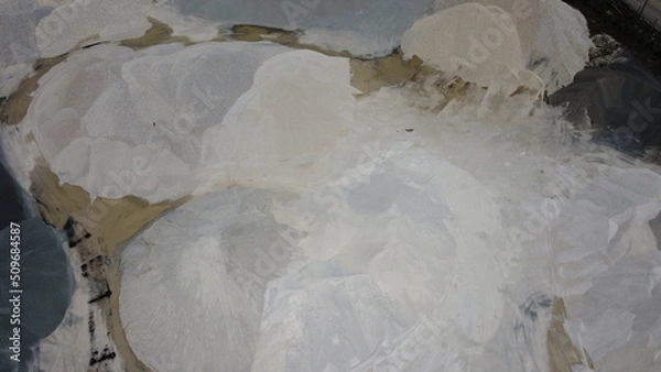 Fototapeta An aerial view of the piles of fine stone in the quarry. Fine stone is used in the production of quality asphalt for roads and for the preparation of concrete used in construction