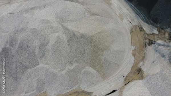 Fototapeta An aerial view of the piles of fine stone in the quarry. Fine stone is used in the production of quality asphalt for roads and for the preparation of concrete used in construction