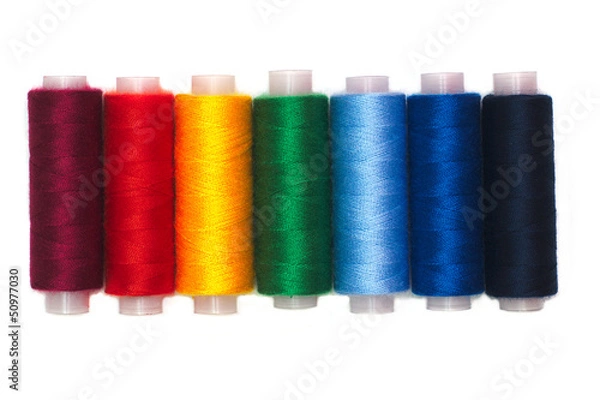 Fototapeta Rainbow colors thread spools isolated