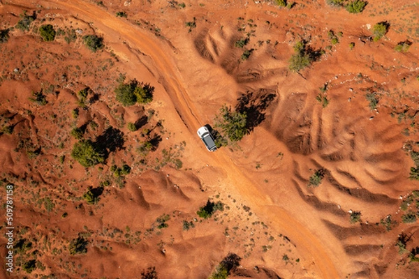 Fototapeta Expedition with offroad car in a desert - Overlanding through the sand dunes