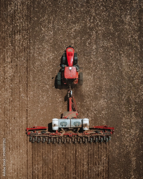 Fototapeta Tractor pulling planter for soybeans