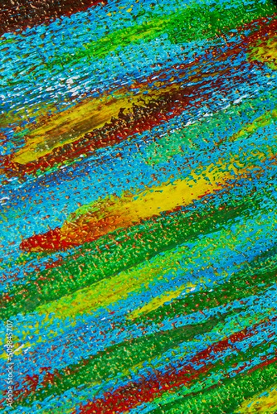 Fototapeta Creative background of colorful brush strokes on canvas closeup. Abstract art background from smeared brush strokes of green red blue yellow colors macro. Drawing painting paint texture backdrop