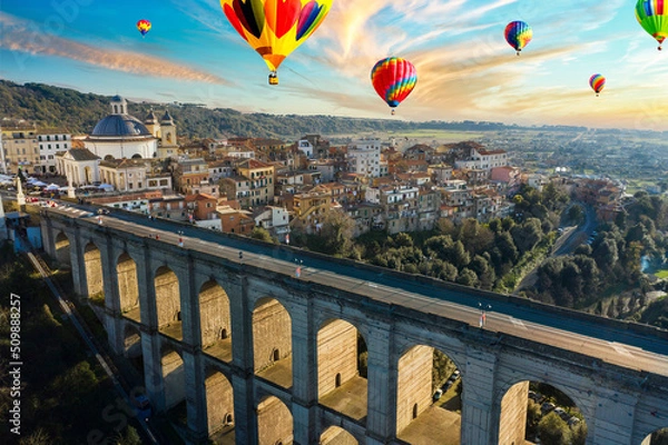 Obraz aerial view at sunset of the Ariccia bridge with hot air balloons