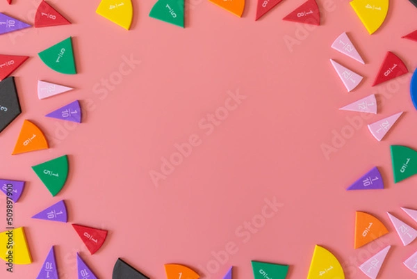 Fototapeta Multicolored fractions, on pink background. Interesting, fun math for kids. Education, back to school concept