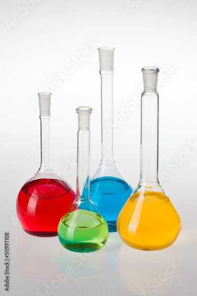 Fototapeta Laboratory glassware with liquids of different colors
