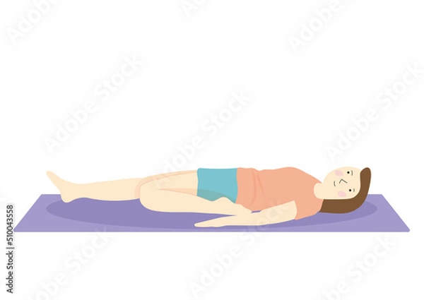 Fototapeta 床に寝て前腿のストレッチをするダイエット中の女性