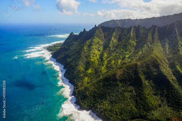 Obraz Aerial view of the dramatic ridges of the Na Pali coast, looming over the Pacific Ocean on the northwestern side of Kauai island in Hawaii