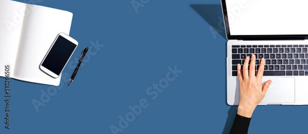 Fototapeta Person using a laptop computer from above