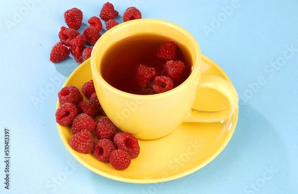 Obraz raspberry tea in a yellow cup