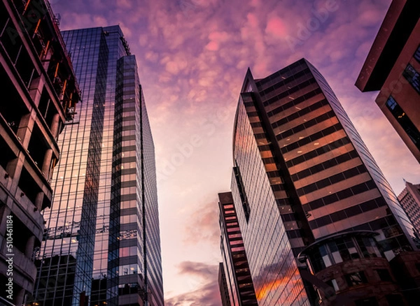 Obraz Tall office skyscrapers with sunset background.