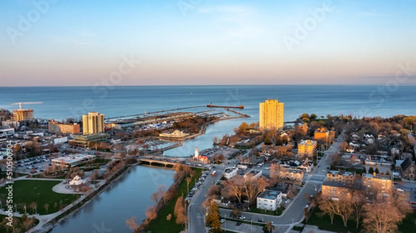 Fototapeta Aerial view of Port Credit at the mouth of the Credit River at sunset facing Lake Ontario in the summer.