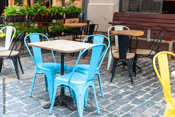 Obraz Chairs and table on empty terrace at cafe .