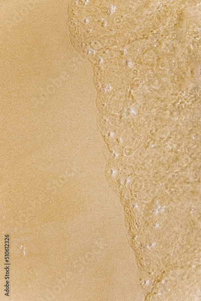 Fototapeta Wave on wet sand, beach vacation, summer time. The concept of tourism, recreation, spa