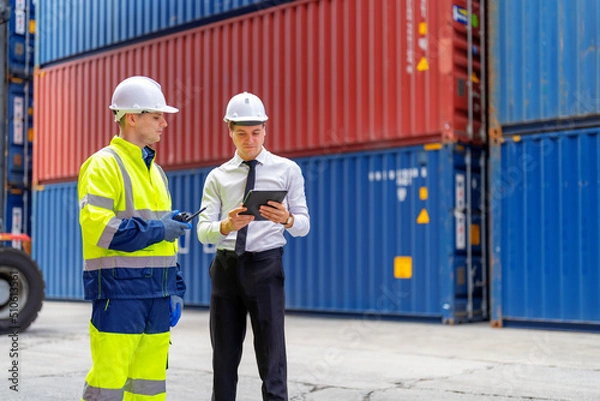 Obraz Container yard manager briefing work plan with the supervisor at container yard warehouse.