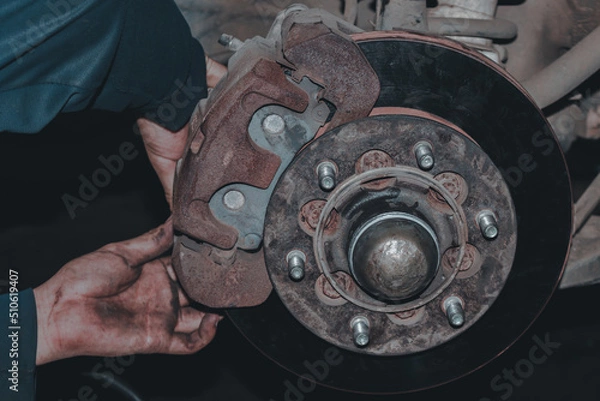 Obraz The mechanic is checking the engine.