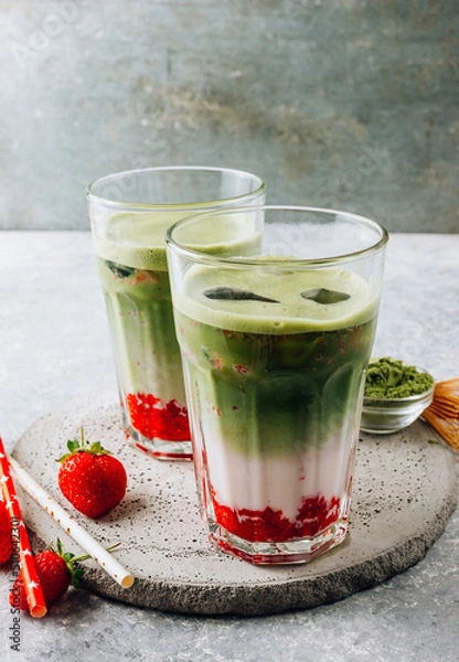 Fototapeta Summer strawberry matcha latte with ice in a glass cup