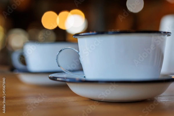 Fototapeta tin coffee mug with bokeh
