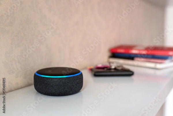 Fototapeta Rio de Janeiro, Brazil - January 28 2021: Amazon Echo Dot smart speaker with integrated Alexa voice assistant, home office.