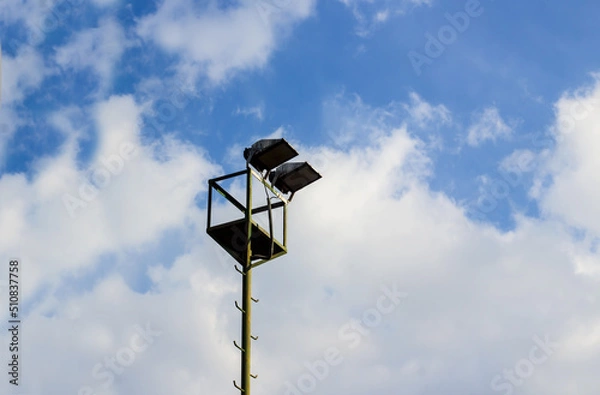 Fototapeta Stadium lamp in blue sky with copy space