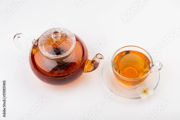 Fototapeta Composition with cup of jasmine tea and flowers on light background