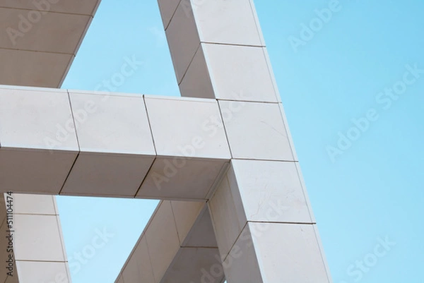 Fototapeta Abstract contemporary architecture. Close  up of some colunms  in a modern building.