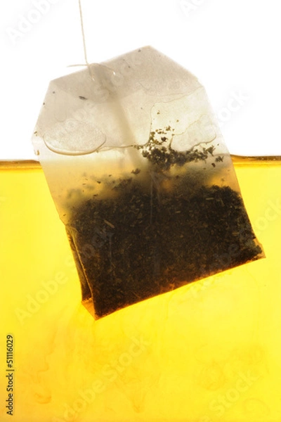 Fototapeta Peppermint Tea bag hanging into hot water
